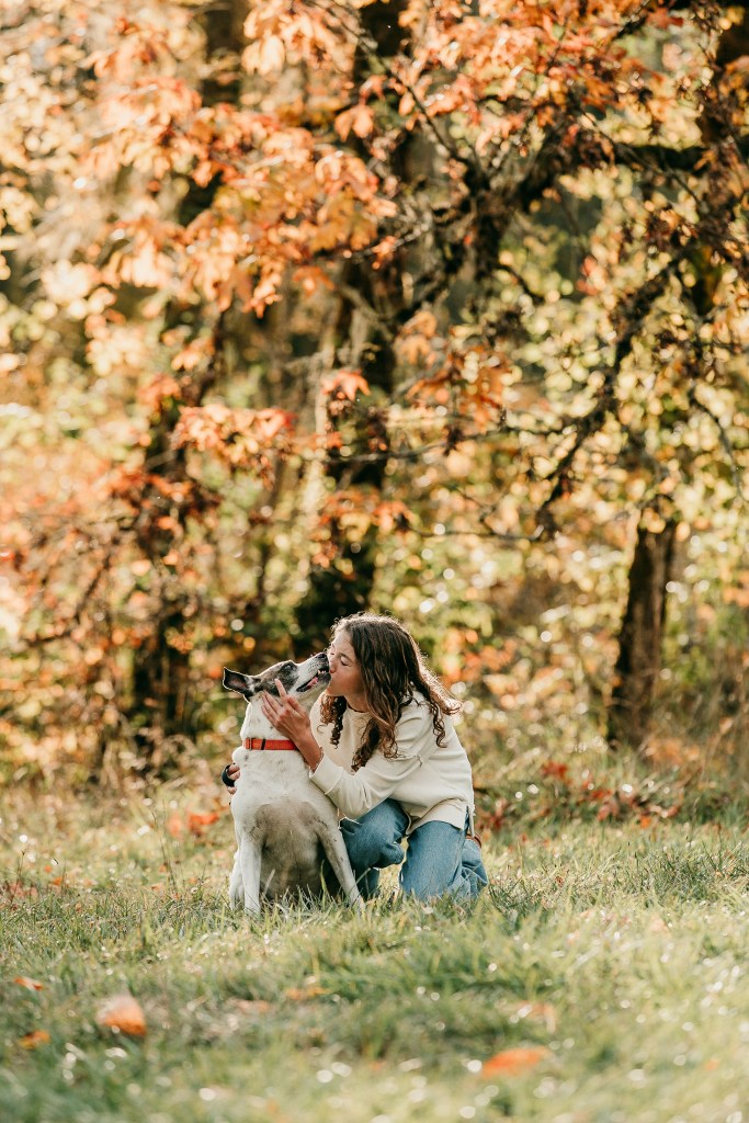 a girl kissing her dog at mt pisgah at a photoshoot in eugene -Springfield Oregon